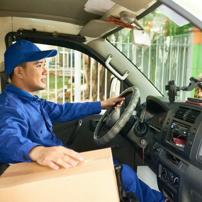 Courier driving delivery truck